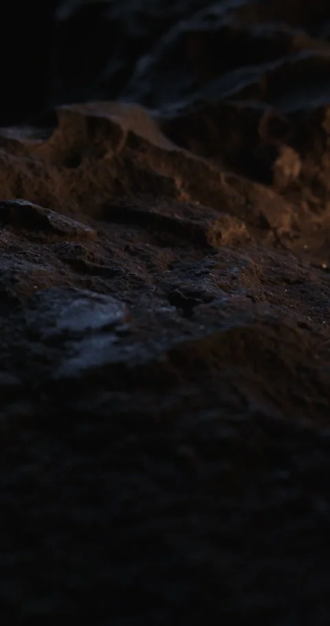 Closeup of Black Stone Surface Texture with Slow Probe Lens Push-In. 動画素材 348755581