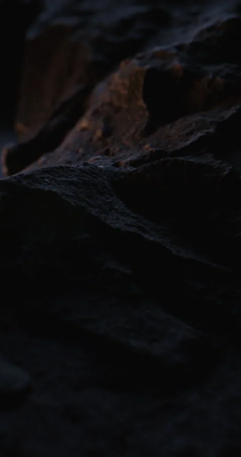 Closeup of Black Stone Surface Texture with Slow Probe Lens Push-In. 스톡 동영상 348755690