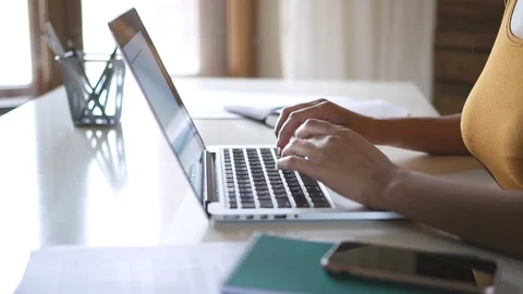 Closeup black woman hands typing on laptop keyboard. Spbd working from home or Stock Footage