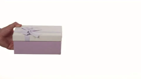 Closeup of a black woman's hand getting a gift box from a white man's hand. Stock Footage 171479760