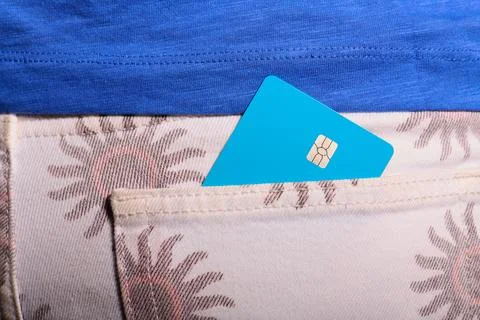 Closeup of a blue debit card with a microchip sticking out of the back pock.. Stock Photos