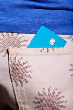 Closeup of a blue debit card with a microchip sticking out of the back pock.. Stock Photos