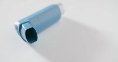 Closeup Of Blue Inhaler On Table Stock Footage 92365734