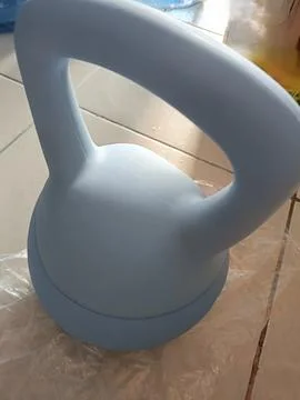 Closeup of a blue kettlebell Stock Photos
