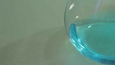Closeup of blue liquid in a glass flask Stock Footage 86372807