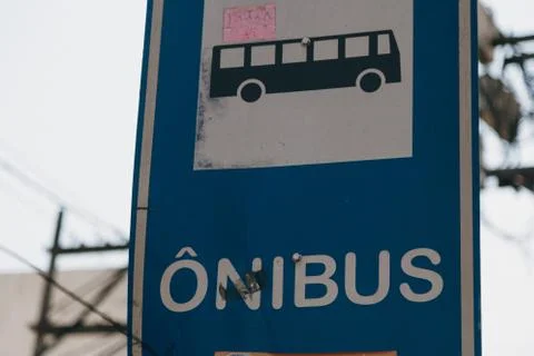 Closeup of a blue "Onibus - bus" station sign at daytime in Portugal Stock Photos