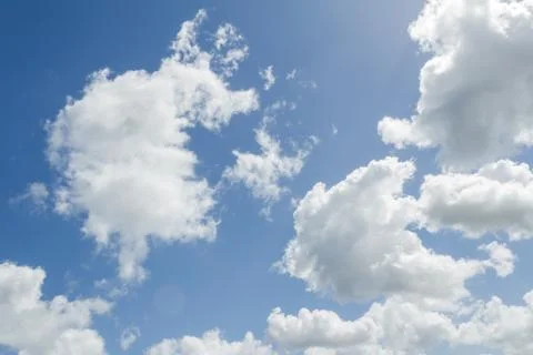 Closeup of blue sky with white clouds Stock Photos