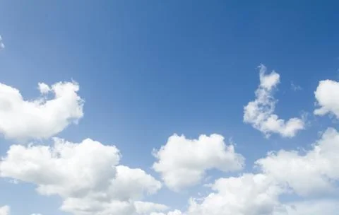 Closeup of blue sky with white clouds Stock Photos