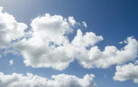 Closeup of blue sky with white clouds Stock Photos