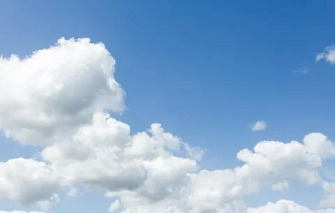 Closeup of blue sky with white clouds Stock Photos