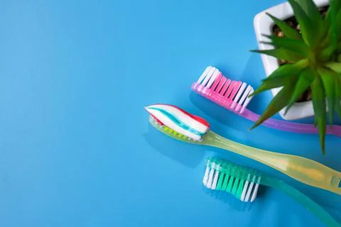 Closeup of blue toothbrush with toothpaste Stock Photos