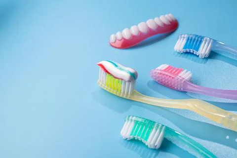 Closeup of blue toothbrush with toothpaste Stock Photos