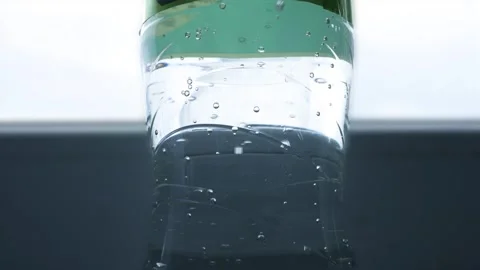 Closeup Blurred Shooting with Bubbles from a Botle with Accidulated Drink Stock Footage 321705365