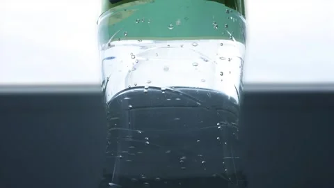 Closeup Blurred Shooting with Bubbles from a Botle with Accidulated Sweet and Stock Footage 340036415