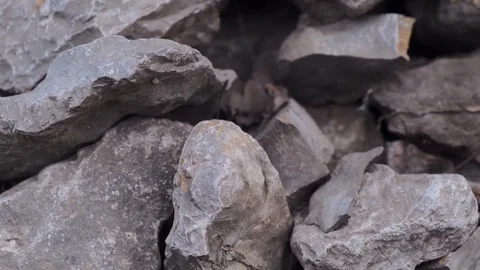 Closeup blurry grey and white stones of different shape. Move the camera angle Stock Footage 126650352