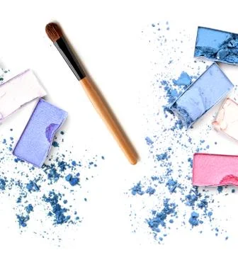 Closeup of blush and multicolor crushed eye-shadows on white background Stock Photos