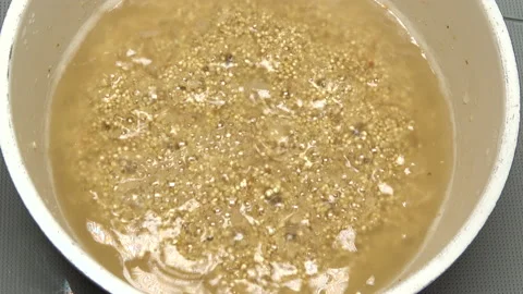 Closeup of boiling Quinoa in the pot. Cooking superfood, vegan food. 4K Stock Footage 168274089