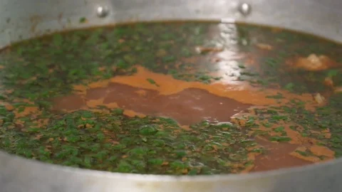 Closeup of the boiling soup with dill, slow motion Video stock 73624441