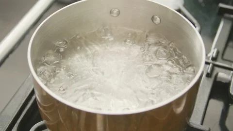 Closeup Of Boiling Water In Hot Cookware At Kitchen Stock Footage 86117969