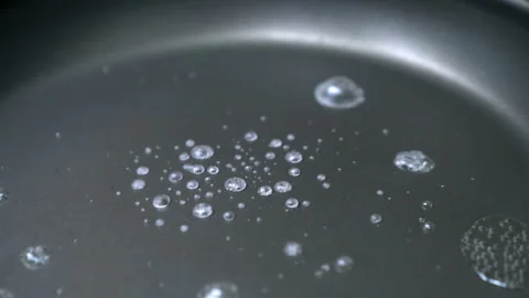Closeup boiling water in a pan Stock Footage 232589166