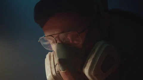 Closeup of a Bomb Maker in the Warehouse making a bomb Vidéo 256036204