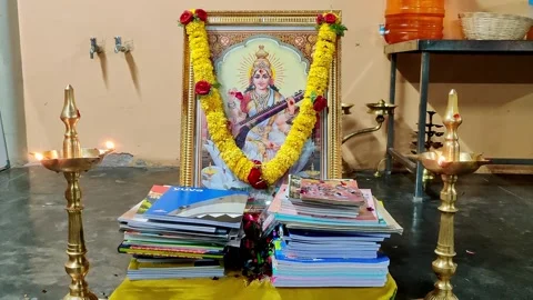 Closeup of Books and Study Materials Placed Before Goddess Saraswati for Di.. Stock Footage 330062354