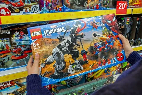 Closeup of box with a Lego constructor in the hands of the buyer. Stock Photos