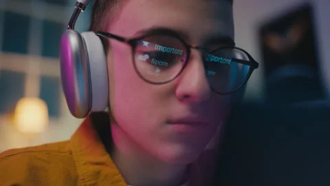 Closeup of boy opening spam folder on computer, phishing, online scam awareness Stock Footage 250336193