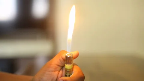Closeup of a boy playing with fire, Lighter Stock Footage 129952071