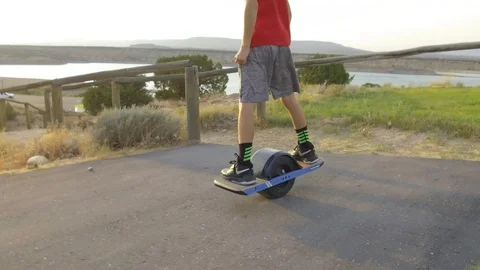 Closeup of Boy Riding OneWheel Stock Footage 97651071