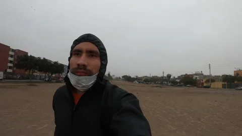 Closeup of a boy running with a black romper and his mask without covering his m Stock Footage 140768614