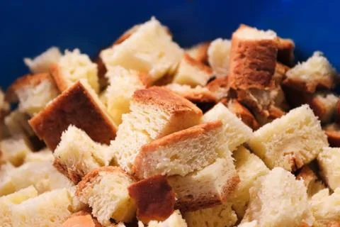 Closeup of bread cube croutons with a blue background Stock Photos