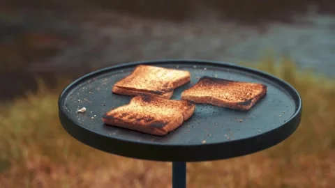 Closeup bread on A grilling pan near river side. Stock Footage 248171913