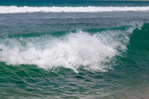 Closeup of breaking wave with another wave in the background Stock Photos