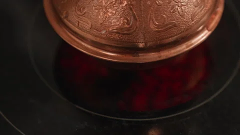 Closeup of brewing coffee process. Elegant cezve brewing with steaming coffee Stock Footage 337316070