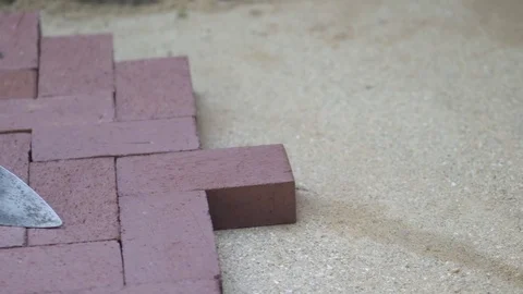 Closeup of the brick paving project showing the bricks in a herringbone pattern Stock Footage 82096740