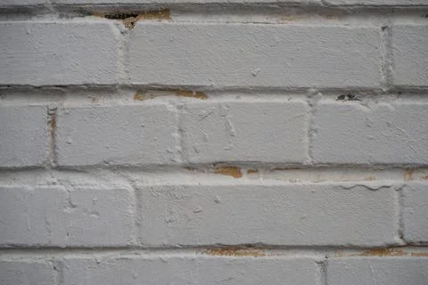 Closeup brick wall painted with gray paint. Old bricks wall texture backgroun 스톡 사진
