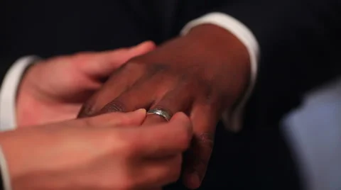 Closeup of bride and groom exchanging wedding rings Stockbeeldmateriaal 41874021
