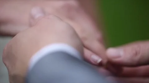 Closeup of bride and groom exchanging wedding rings. Slow motion Stock Footage 47729000