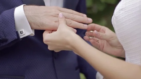 Closeup of bride puts on ring groom Video stock 84135178