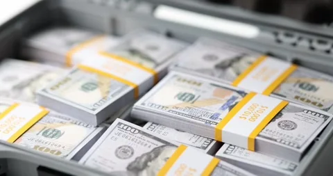 Closeup of briefcase full of stacks of dollar bills Stock Footage 244215784