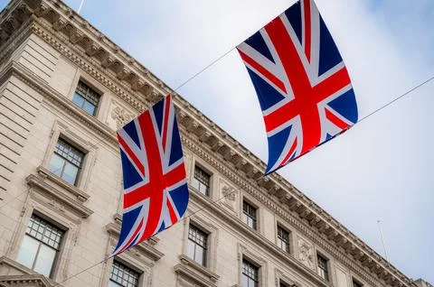 Closeup of British Union Jack flags in London street Stock Photos