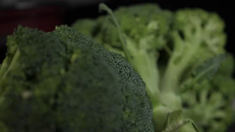 Closeup with broccoli on a black background Stock Footage 137211263
