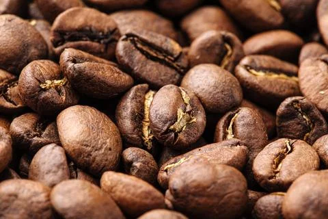 Closeup on brown coffee beans texture pattern Stock Photos