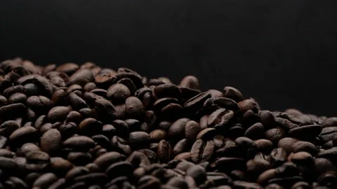 Closeup brown roasted coffee beans texture background with white steam or smoke Stock Footage 144199162