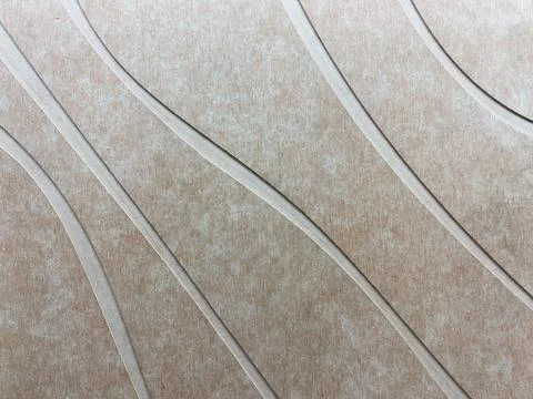 Closeup of a brown textured surface with flowing diagonal grooves Stock Photos