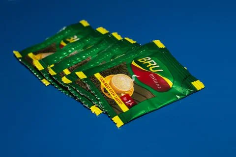 Closeup of Bru Instant Coffee Pack isolated on Blue Background Stock Photos