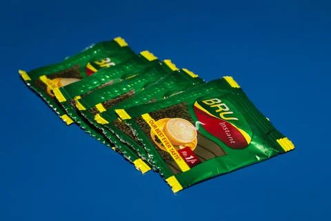 Closeup of Bru Instant Coffee Pack isolated on Blue Background Stock Photos