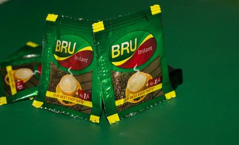 Closeup of Bru Instant Coffee Pack isolated on Green Background Stock Photos