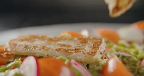 Closeup of bruschetta with cherry, radish and chicken cutlet. 4k slow motion Stock Footage 101371342